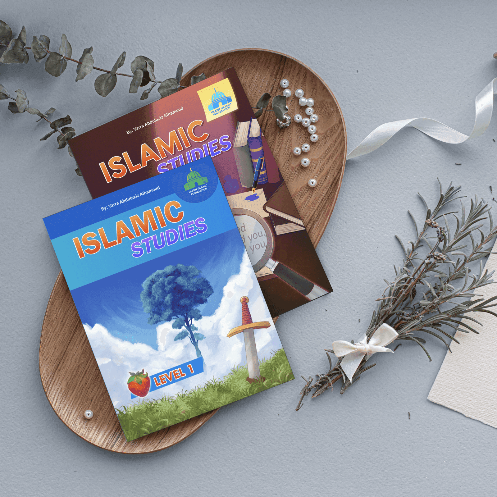 The printed Islamic Studies Level 1 series — Textbook, Activity Book, and Teacher's Manual, authored and designed by Yarra Abdulaziz Alhamoud, styled on wooden plates